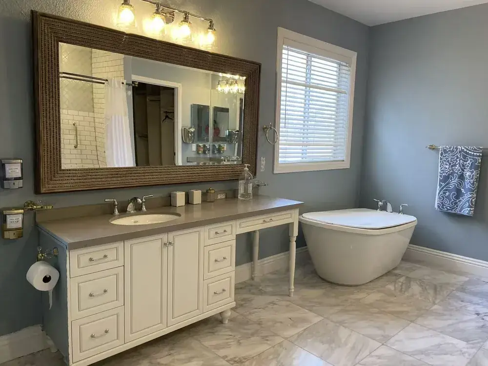 A clean, spacious resident bathroom with a soaking tub