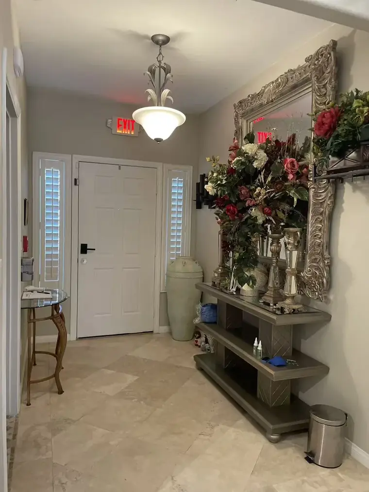 The warm, welcoming front entry at Caring Angels Henderson with fresh flowers