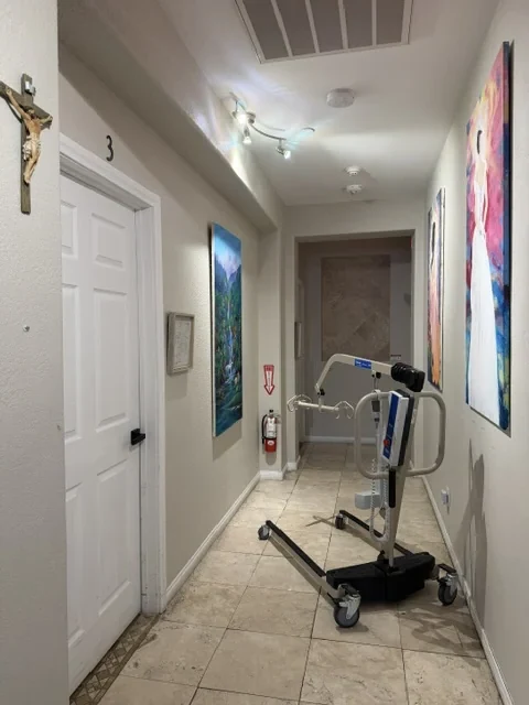 ProHealth Electric Life patient lift in a hallway at Caring Angels Henderson